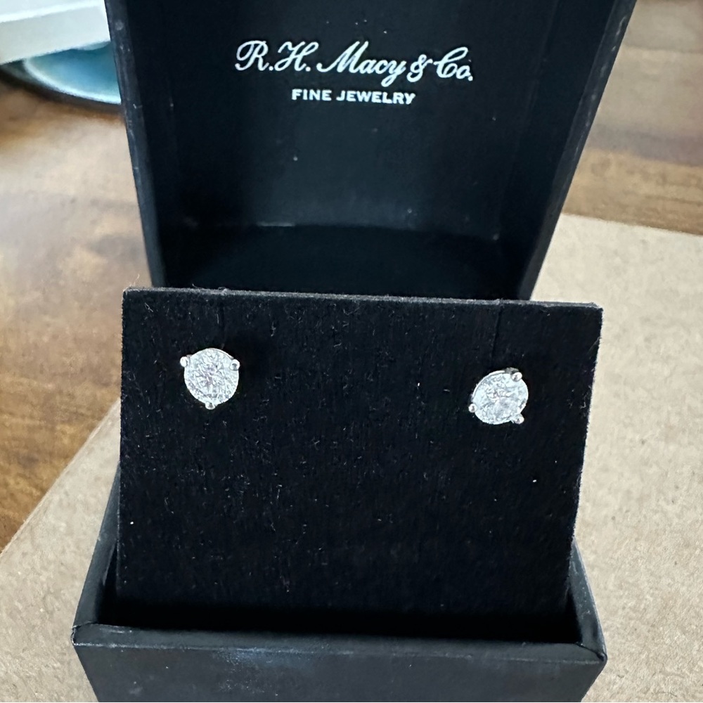 For timeless style, round-cut near colorless diamond studs in 18k white gold